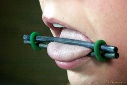 Tongue torture and deep throat rape for captive beautiful whore