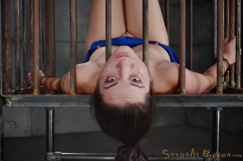 Caged whore sucks a dick with blindfolded eyes