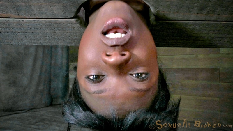 Suspended athletic ebony with a white dick in the mouth