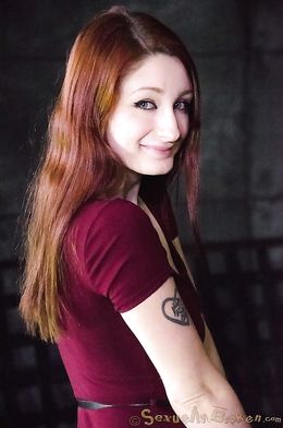 Gagged redhead with green eyes likes domination and sex