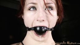 Gagged redhead with green eyes likes domination and sex